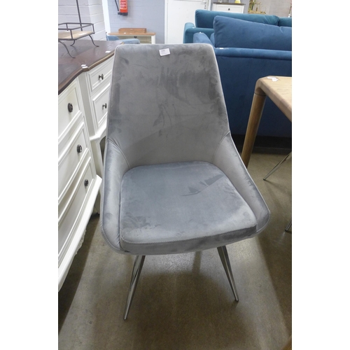 1403 - A set of six light grey velvet dining chairs on chrome legs *This lot is subject to VAT