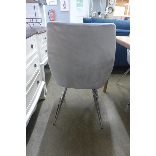 1403 - A set of six light grey velvet dining chairs on chrome legs *This lot is subject to VAT