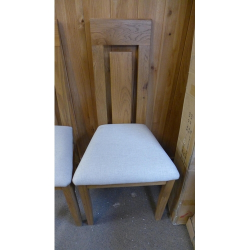 1494 - A pair of oak dining chairs * This lot is subject to VAT