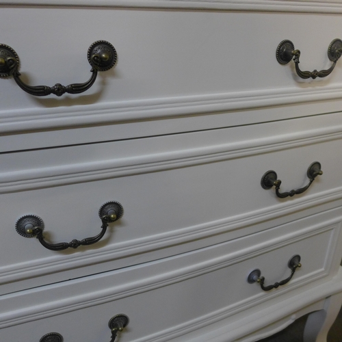 1506 - A white three drawer french style chest