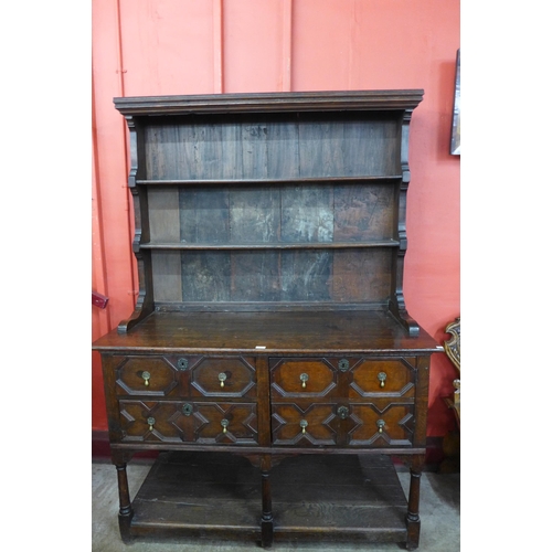 10 - A Jacobean Revival oak geometric moulded dresser