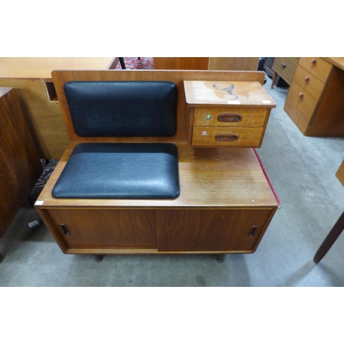 102 - A Danish teak and vinyl telephone table