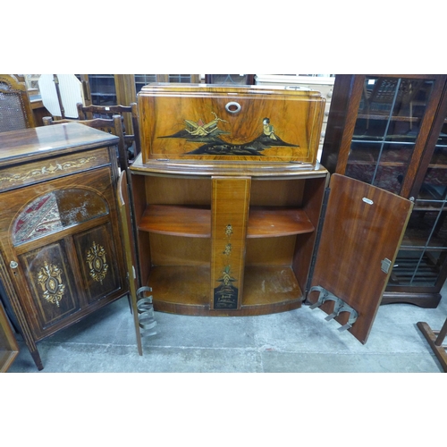 109 - A Japanned walnut cocktail cabinet