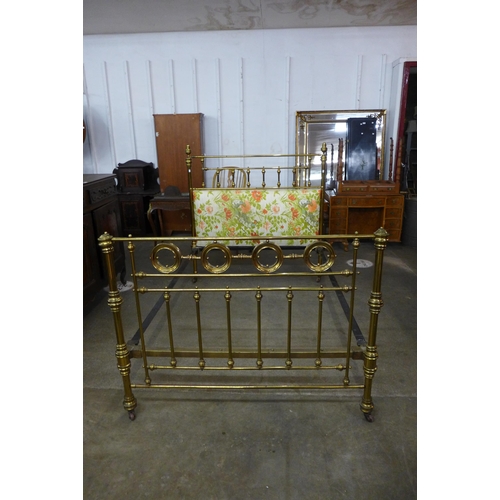 122 - A Victorian brass double bed