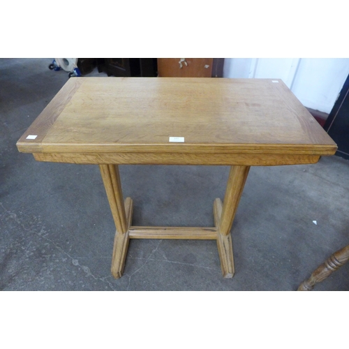 127 - A Cotswold style oak fold over table