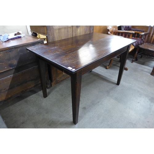 133 - An oak dining table