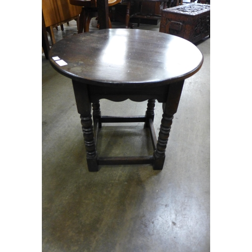 134 - An oak circular occasional table