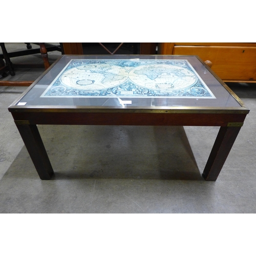 140 - A mahogany and brass mounted Atlas topped coffee table