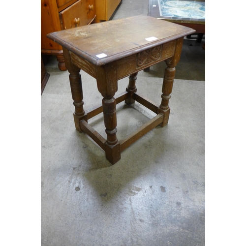 141 - A carved oak joint stool