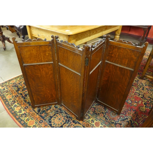 15 - A Victorian oak and mirrored folding screen