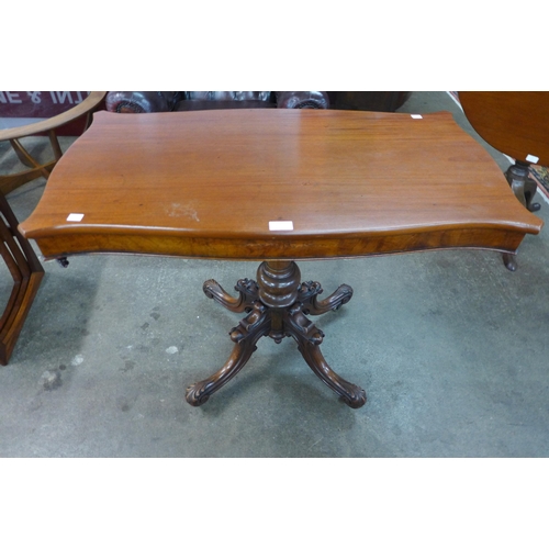 24 - A Victorian mahogany serpentine side table