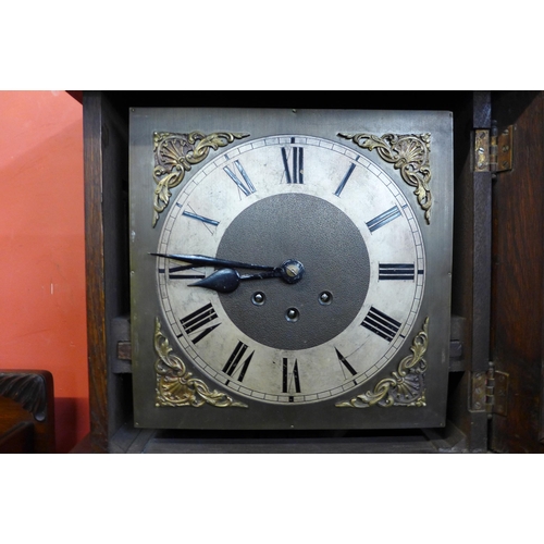 35 - An early 20th Century oak longcase clock