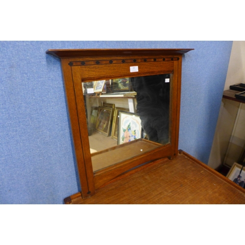 383 - An Arts and Crafts inlaid oak framed mirror, manner of Liberty & Co.