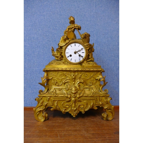 401 - A 19th Century French gilt metal mantel cock, the enamelled dial signed Promoli & Hausburg, A Paris