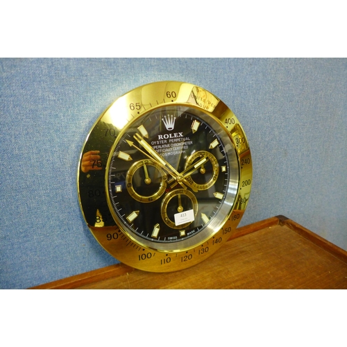 413 - A Rolex style dealer's wall hanging clock