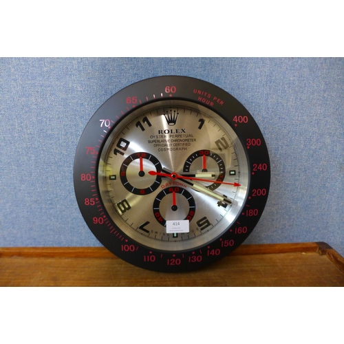 414 - A Rolex style dealer's wall hanging clock