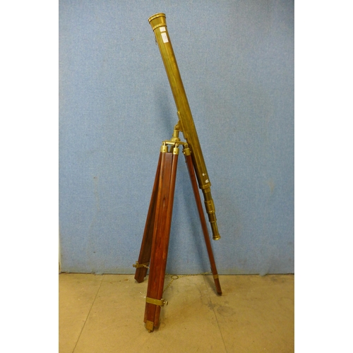 416 - A brass telescope on tripod stand