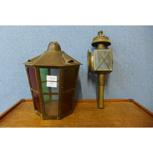 423 - Two brass lamps