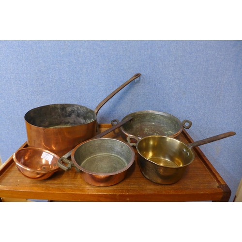 425 - Copper saucepans, a brass jam pan, ladle, etc.