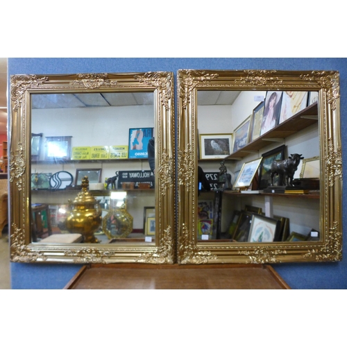 428 - A pair of gilt framed mirrors