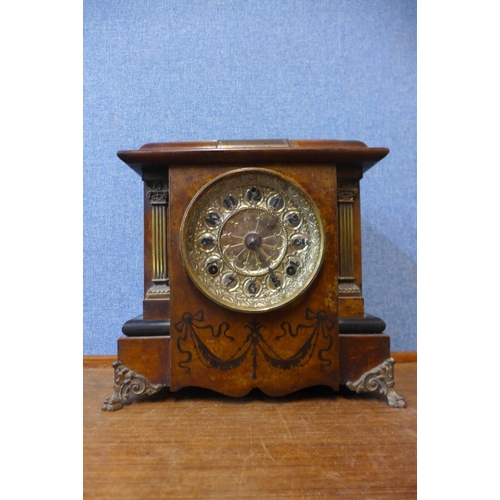 438 - An early 20th Century continental faux walnut mantel clock, with Masonic presentation plaque