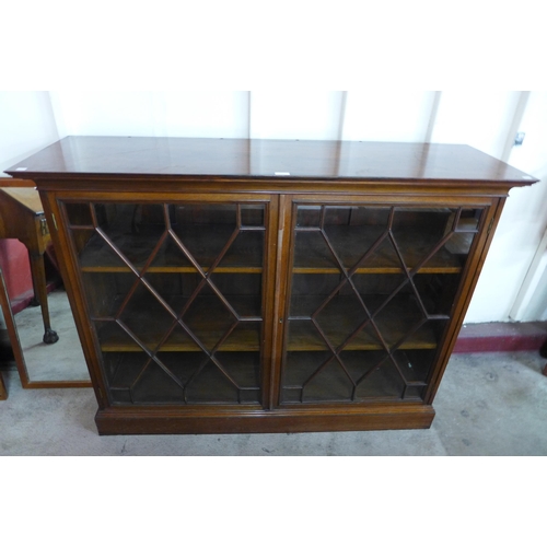 53 - A George III style mahogany astragal glazed two door bookcase