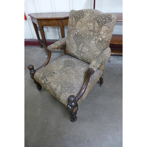 54 - A Gainsborough style carved mahogany and fabric upholstered armchair