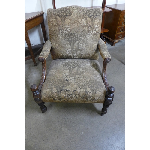 54 - A Gainsborough style carved mahogany and fabric upholstered armchair