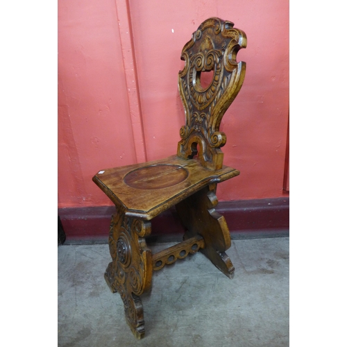 8 - A pair of 19th Century Italian carved walnut sgabello hall chairs