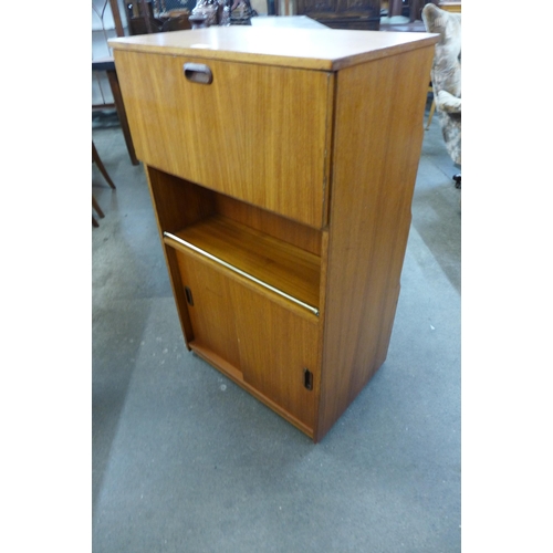 84 - A teak double sided writing cabinet/bookcase