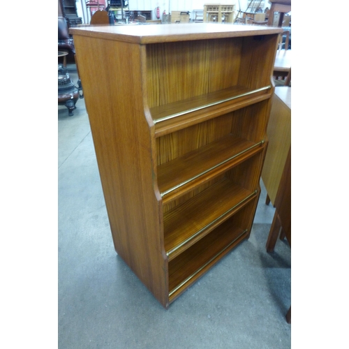 84 - A teak double sided writing cabinet/bookcase