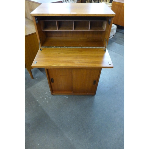 84 - A teak double sided writing cabinet/bookcase