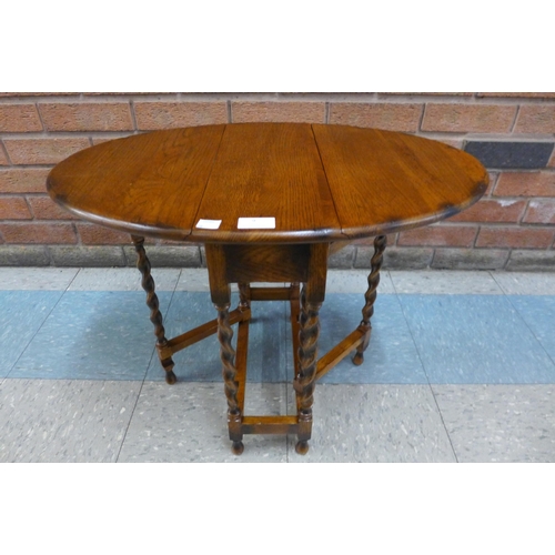 9 - A small oak barleytwist gateleg occasional table