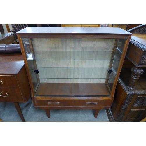 93 - A teak display cabinet