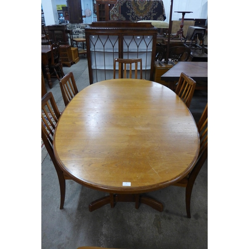 97 - A G-Plan Fresco teak extending dining table and seven chairs