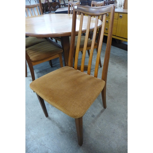 97 - A G-Plan Fresco teak extending dining table and seven chairs