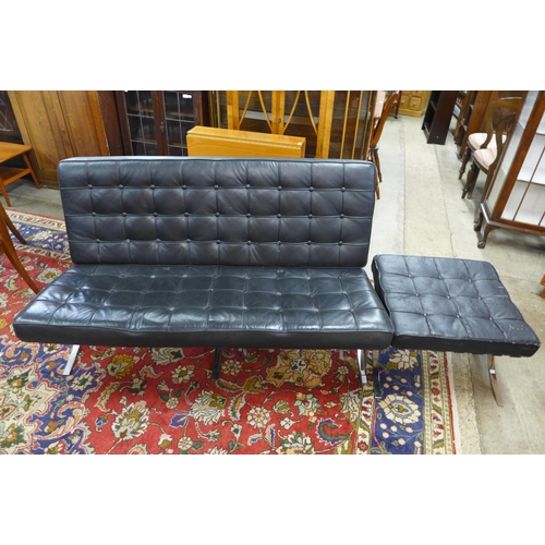 98 - A Barcelona style chrome and black leather sofa and footstool