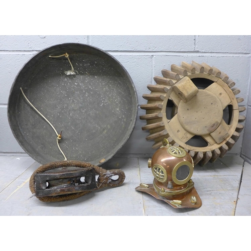 1232 - Ship related items, including a pulley, a miniature diver's helmet and a piece of windmill equipment... 