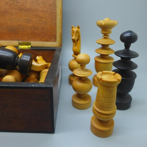 636 - A Georgian Mahogany box containing a boxwood chess set