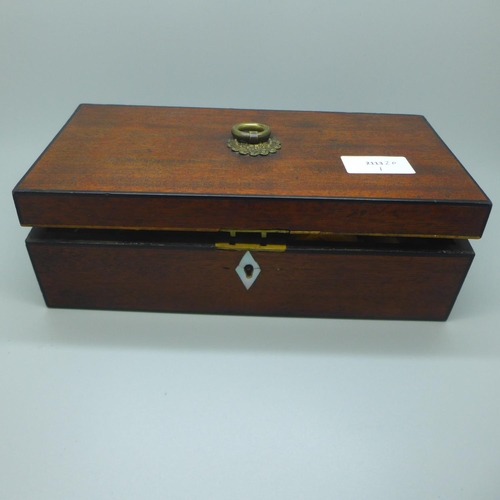 636 - A Georgian Mahogany box containing a boxwood chess set