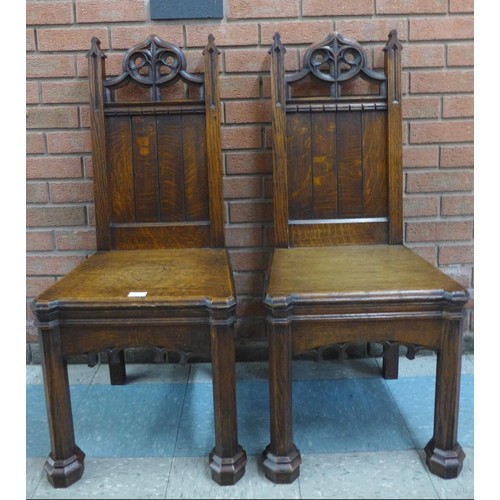 2 - A pair of Victorian Gothic Revival oak hall chairs, manner of A.W.N. Pugin