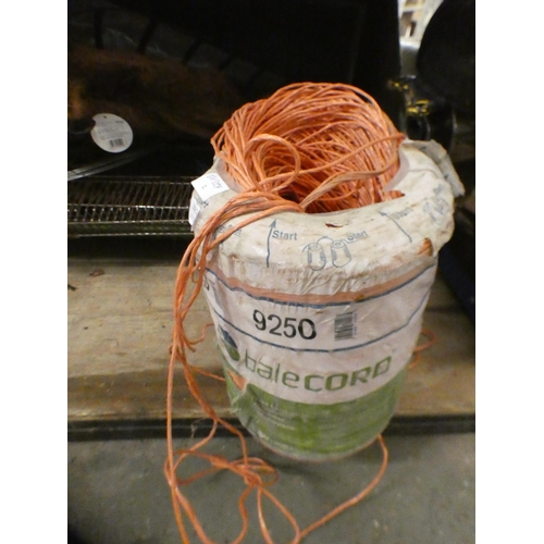 2081 - Large reel of orange agricultural twine/bale cord with a wood 4ft 6