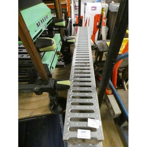 2089 - 2 x 1m metal-topped concrete drainage channels