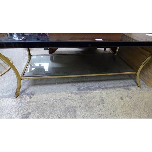 1733 - A gold metal and glass coffee table, damaged * this lot is subject to VAT