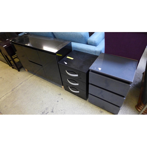 1734 - A black two drawer two door sideboard, a grey three drawer bedside chest and a black two drawer beds... 