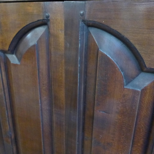 1754 - A Gothic style floor standing corner cupboard, with bi-fold doors