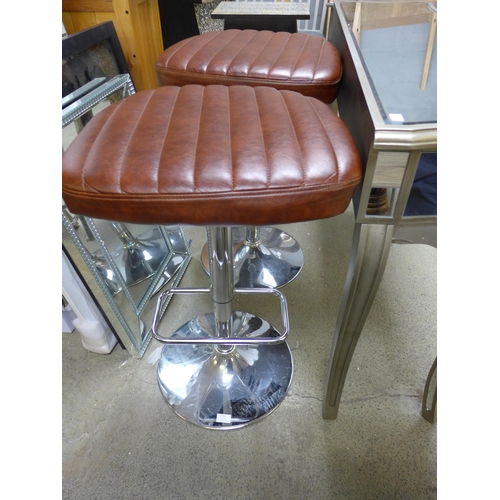 1762 - A pair of tan leather effect bar stools * this lot is subject to VAT