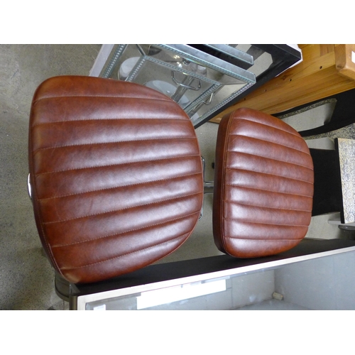 1762 - A pair of tan leather effect bar stools * this lot is subject to VAT