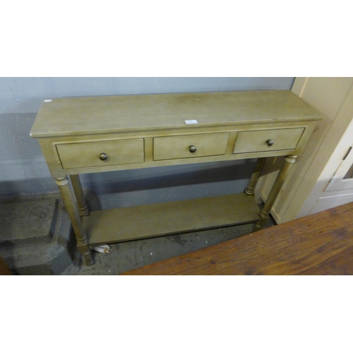 1774 - A gold three drawer antique style console table (scratched)