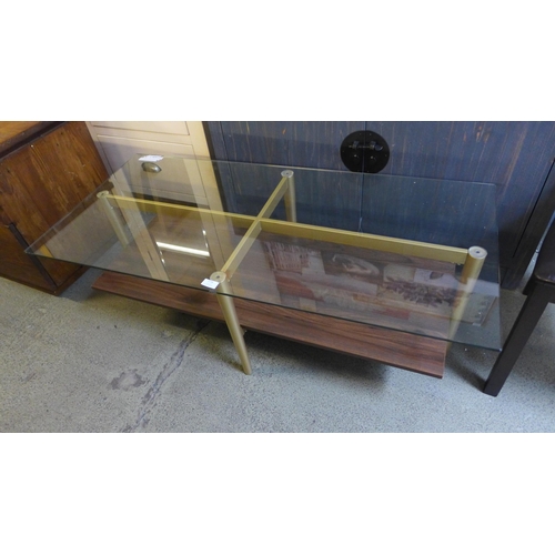 1776 - A glass topped coffee table * This lot is subject to VAT